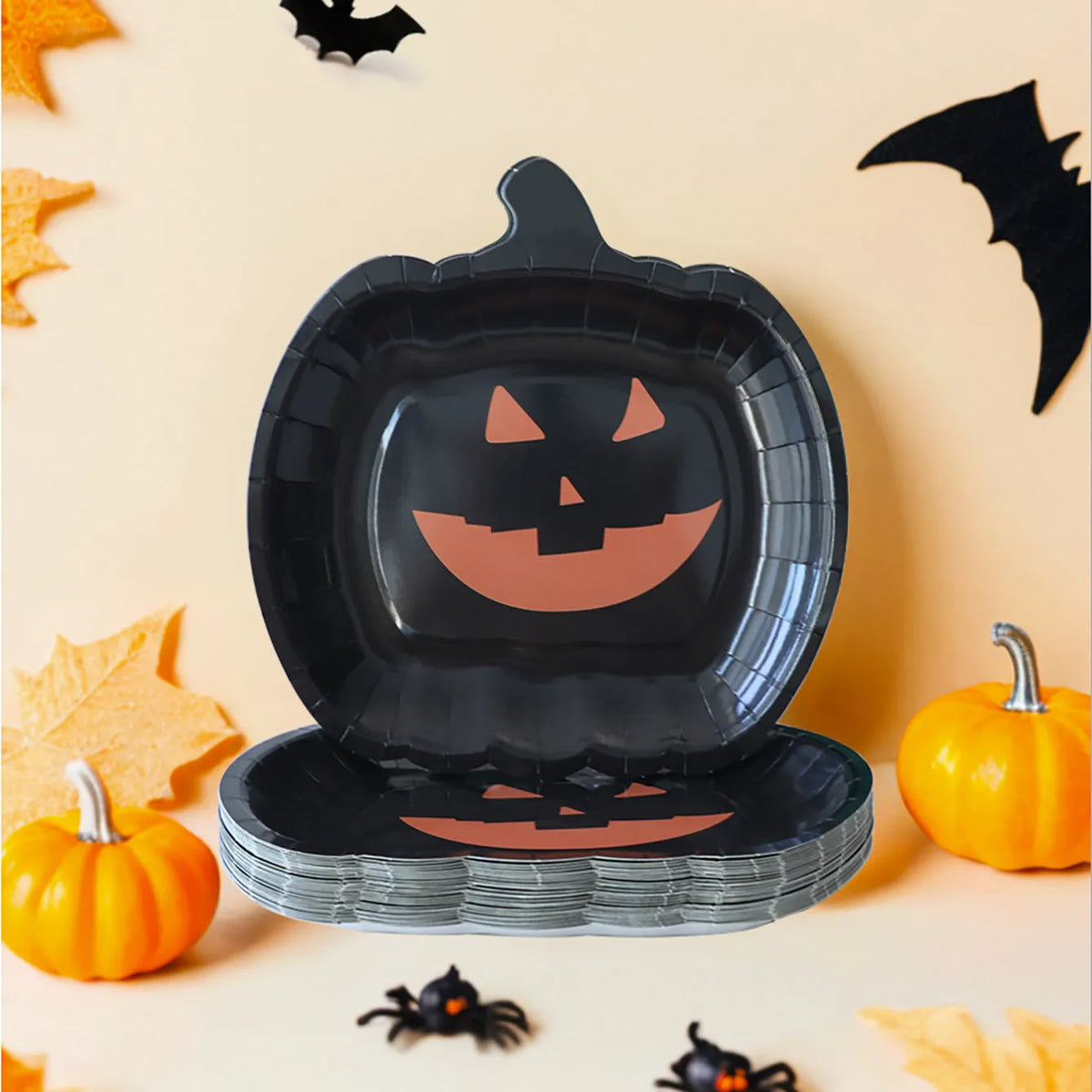 Black Halloween pumpkin design paper plates in 9-inch size showing thickened disposable construction