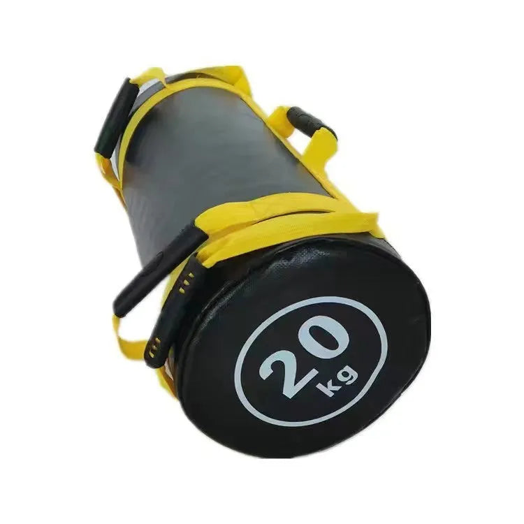 Flat white leather PVC fitness training sandbag shown in a gym setting for weight lifting and conditioning.
