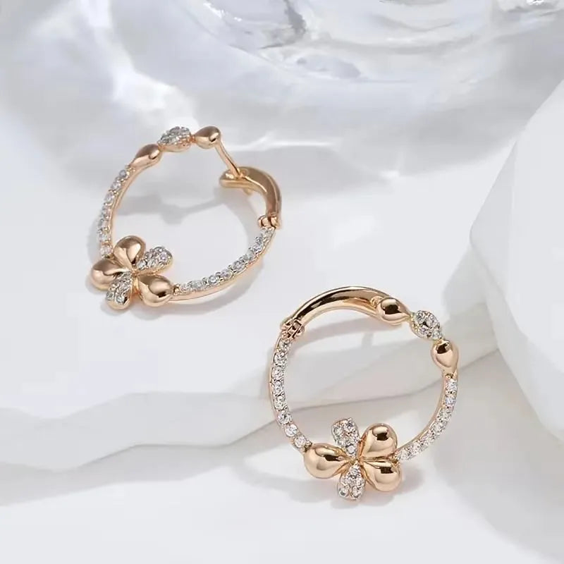 A pair of round copper hoop earrings for women with an electroplated finish.