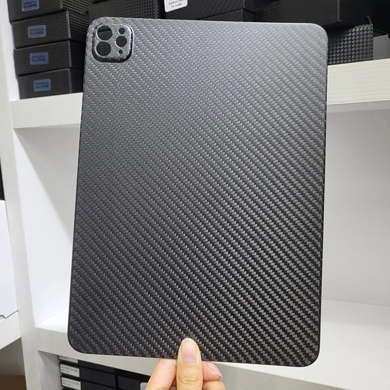 Carbon fibre hard case for Apple iPad Pro 11 showing embossed plaid pattern and matte finish.