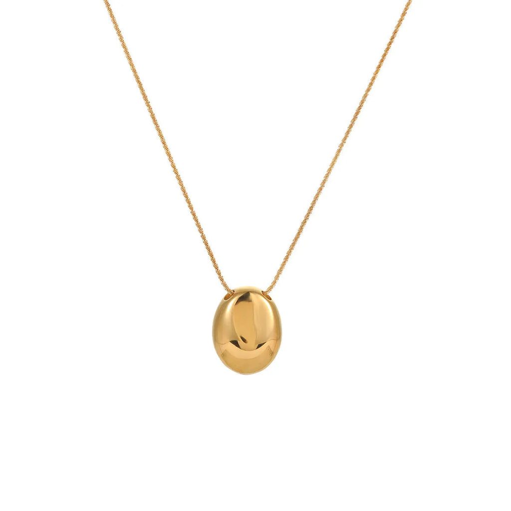 Gold geometric pendant necklace with adjustable chain on stainless steel background