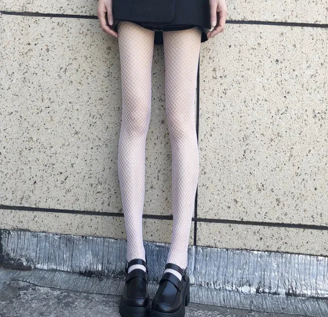 Women's summer stockings showing large, medium, and small mesh patterns in black and white colours.