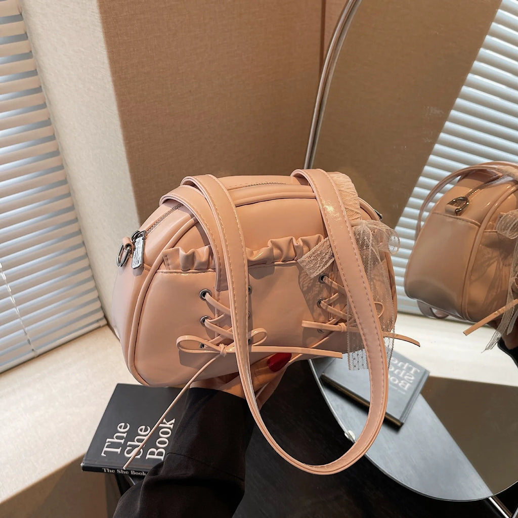 Ladies casual shoulder bag with bandage bow detail and internal mobile phone compartment