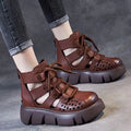 Women's black platform sandals with hollow hole design and fish mouth toe in soft cowhide leather.