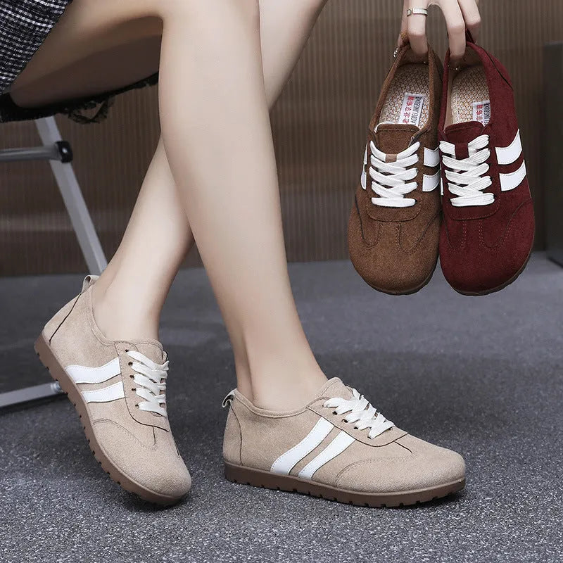 Women's vintage canvas sneakers in dark red with round toe and flat rubber sole