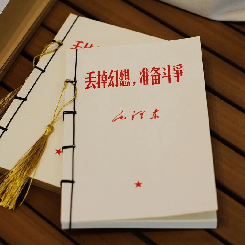 A5 antique wire-bound notebook with glossy embossed cover featuring a retro painting design, shown open.