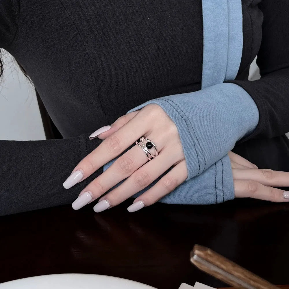 S925 sterling silver women's ring with inlaid black agate, multi-line hollow geometric design, adjustable open band.