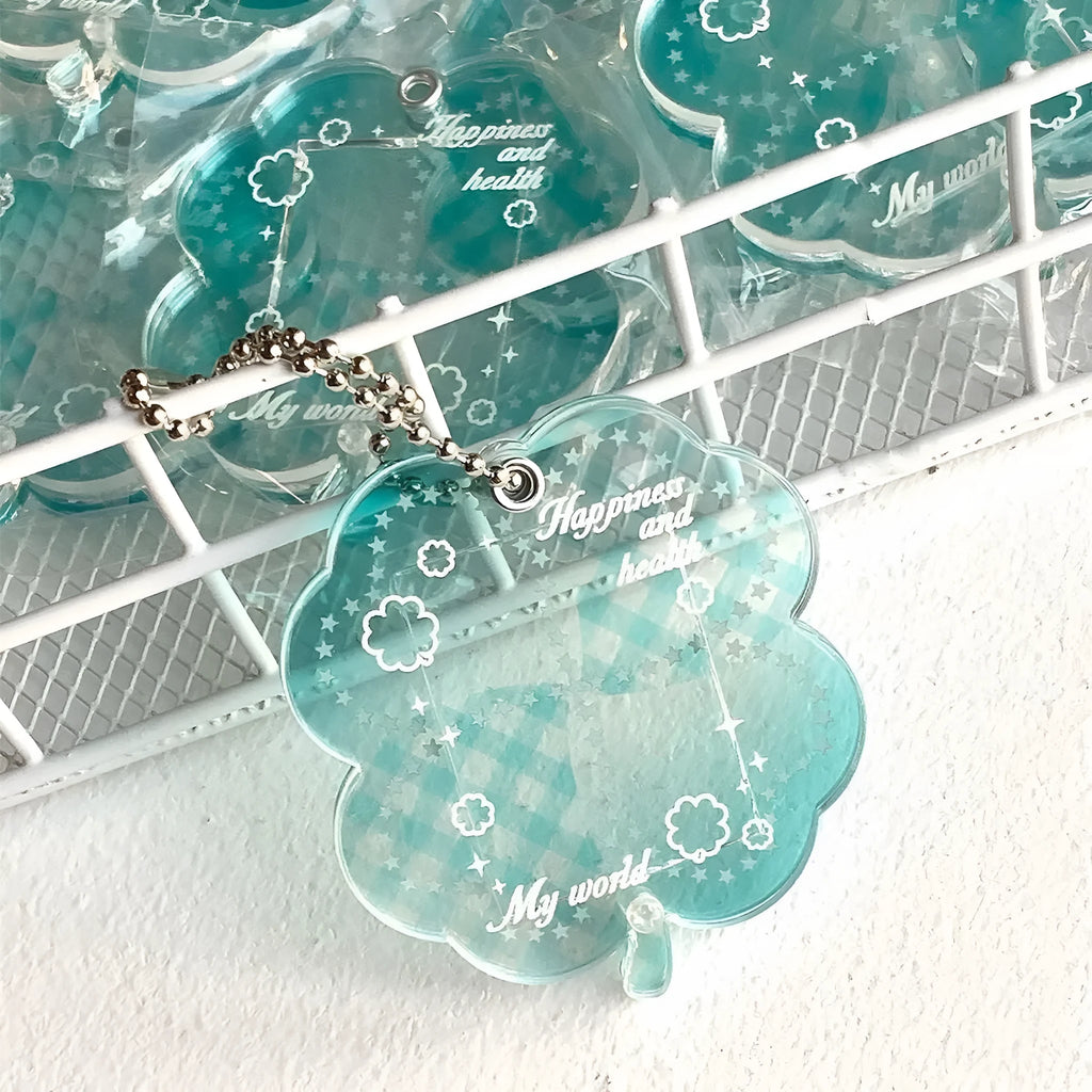 Acrylic four-leaf clover pendant keychain in elegant blue, grass green, and mint green colours.