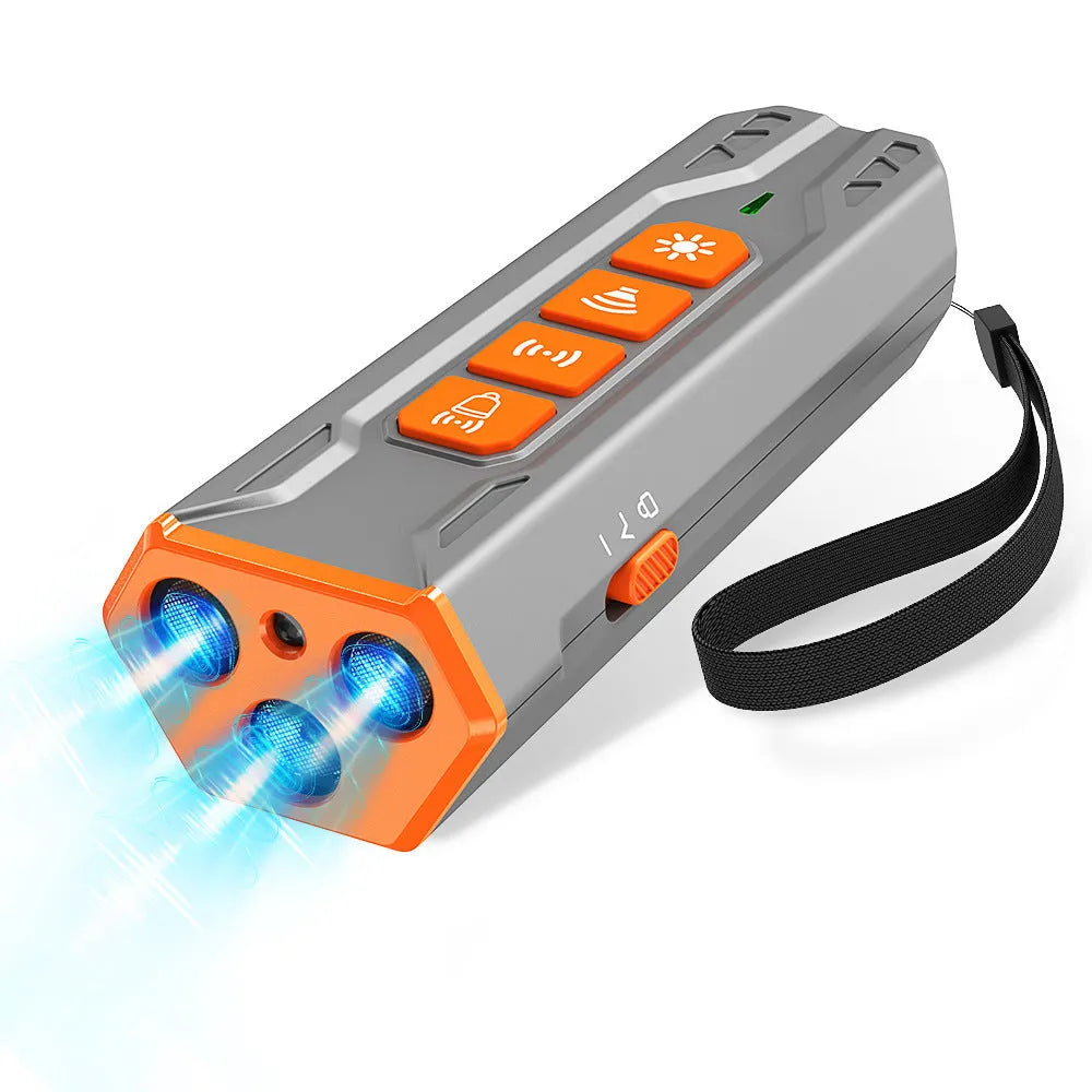 Grey and orange ultrasonic dog trainer device with three sound emitters on a black background.