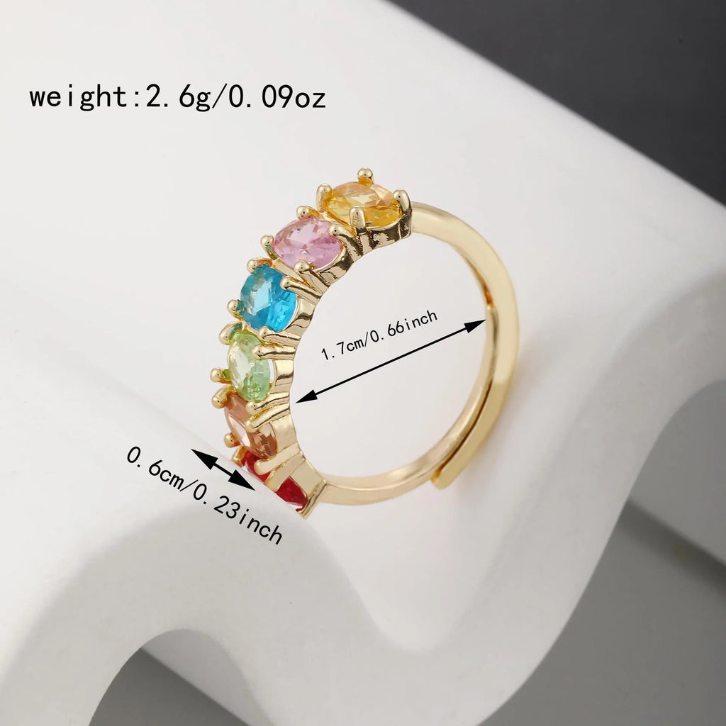 Gold-colour adjustable copper ring with a zircon stone in a simple retro style.