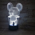 Black koala-shaped LED night light with remote control on a white surface