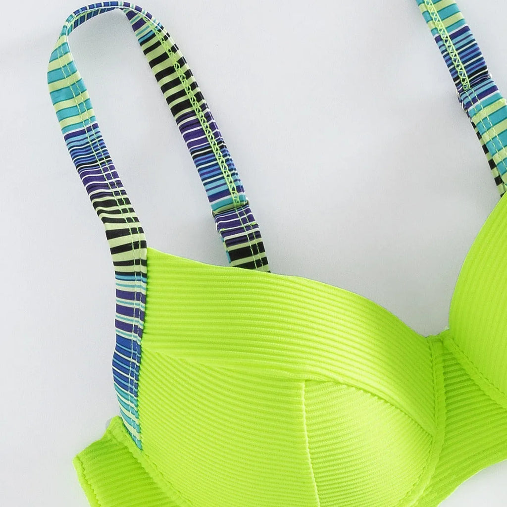 Green printed women's halter bikini with briefs bottoms on white background