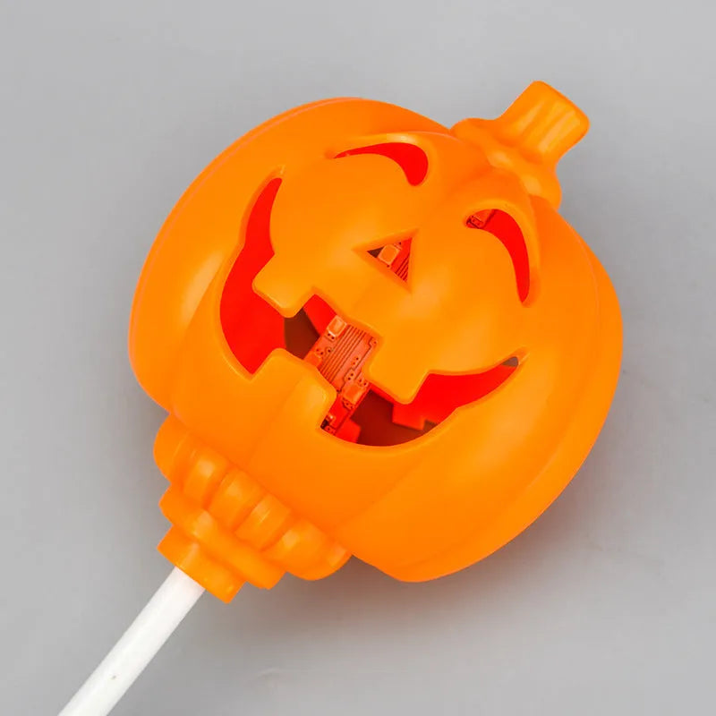 Plastic pumpkin lamp with USB charging cable in purple or yellow light colour