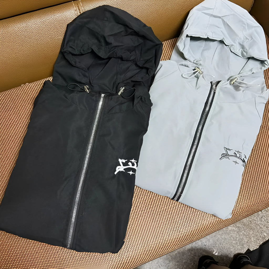 Grey loose-fit men's hooded jacket in British style on a hanger