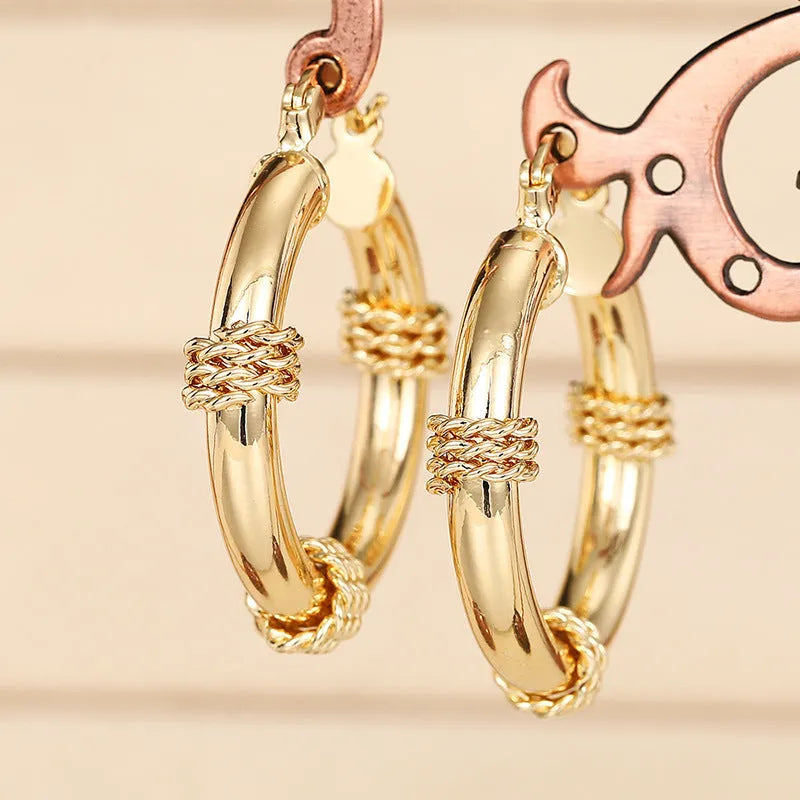 Geometric copper women's earrings with ring ear clip design in golden colour