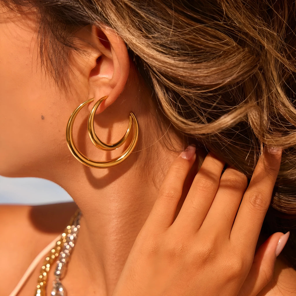 Titanium steel hoop earrings with geometric round design in gold and steel finish options