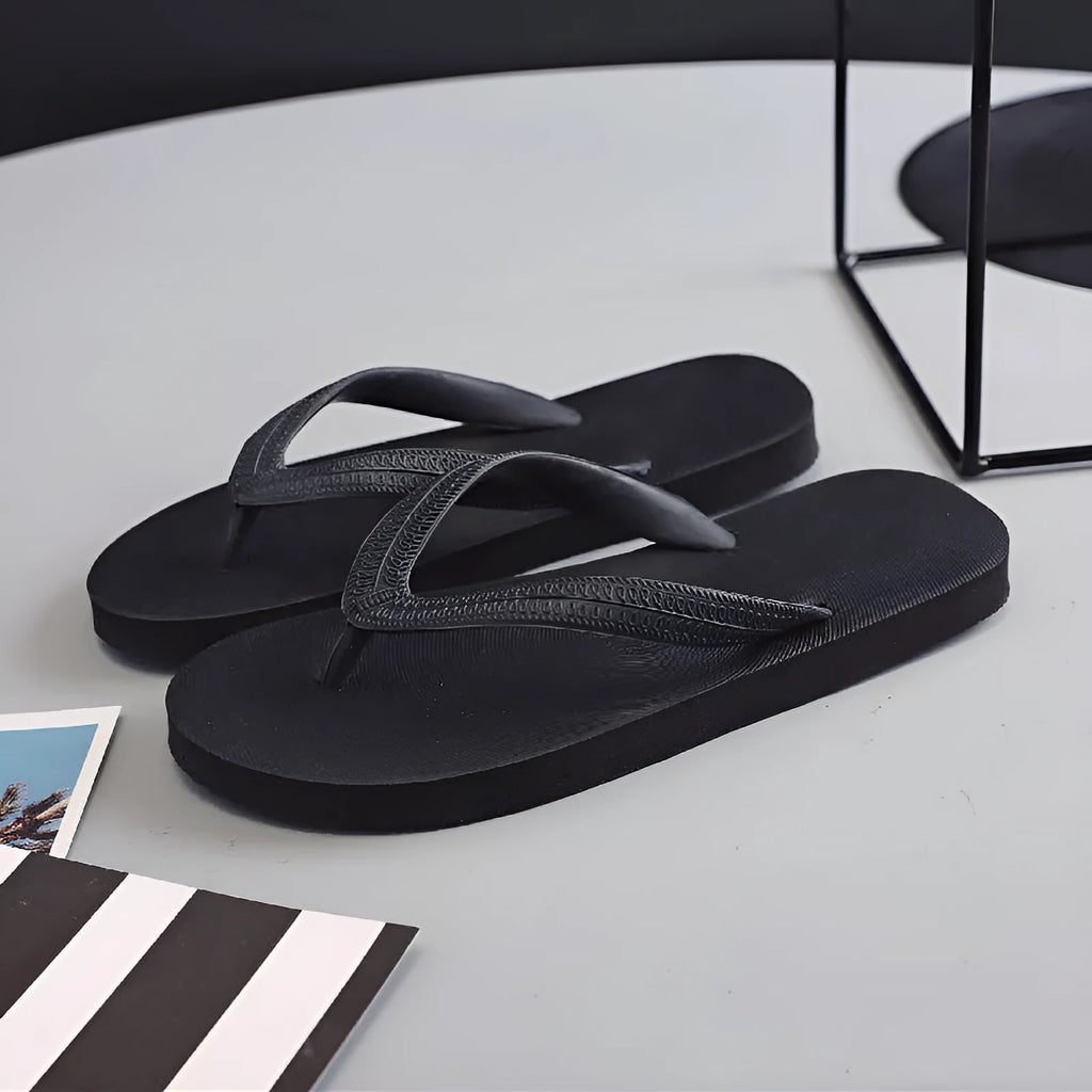 Deodorant rubber beach flip-flops with fish label design in black, blue, green, and red colour options