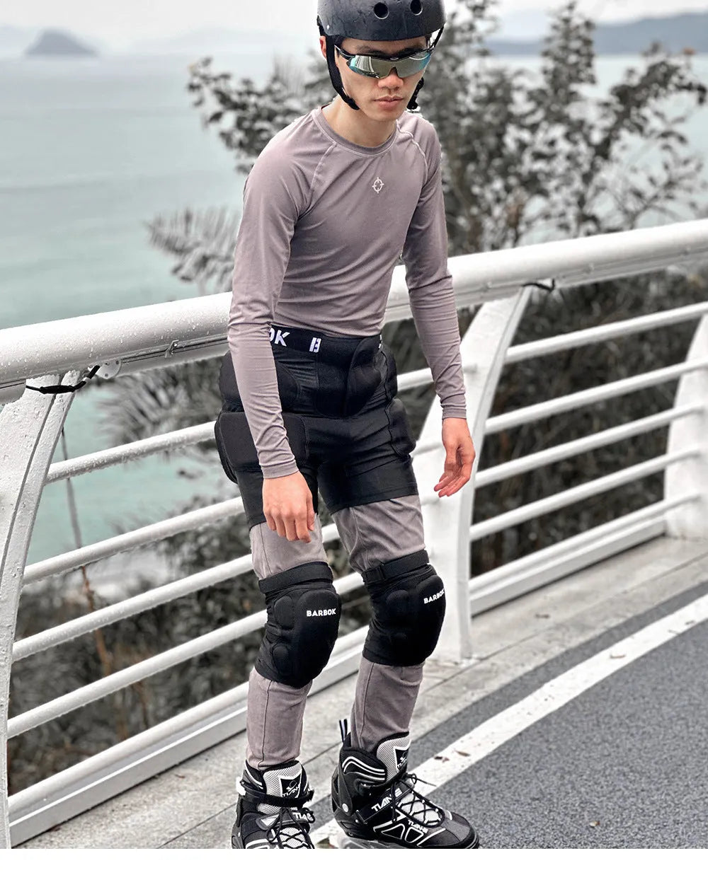Adult black spandex hip pad pants with built-in protective padding for roller skating and skateboarding.