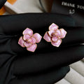 Gold plated purple floral stud earrings with oil-spot glaze colour variation on copper