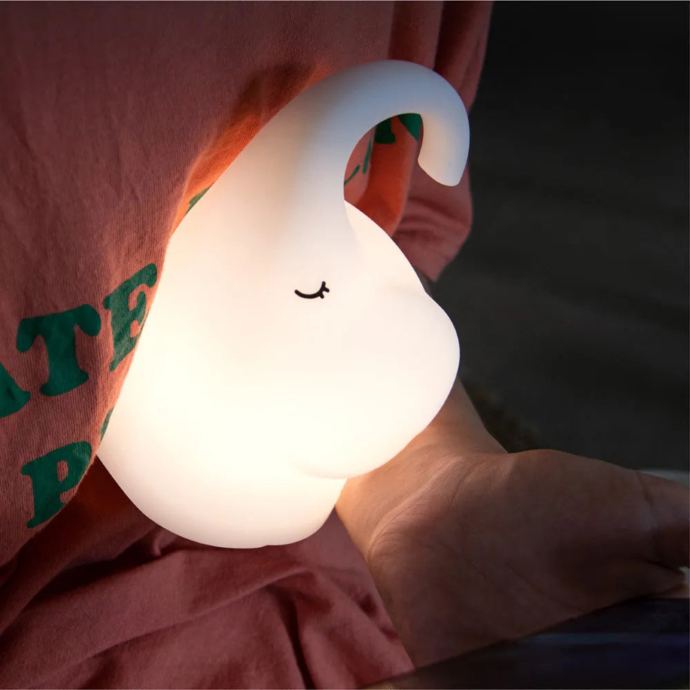 Elephant-shaped silicone night light with warm LED illumination for bedroom bedside use