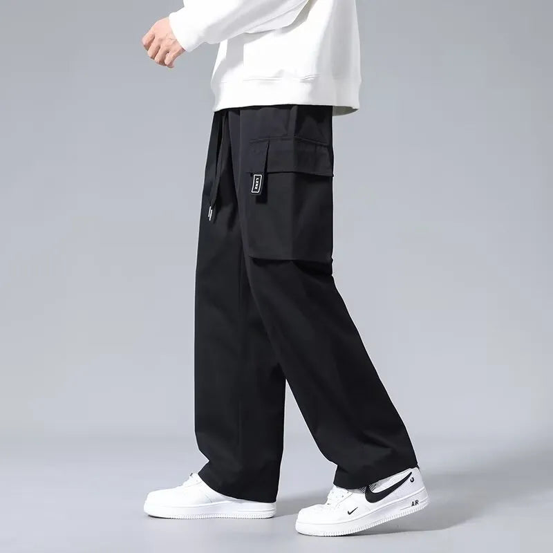 Boys cargo pants with drawstring waist and large side pockets in polyester fabric