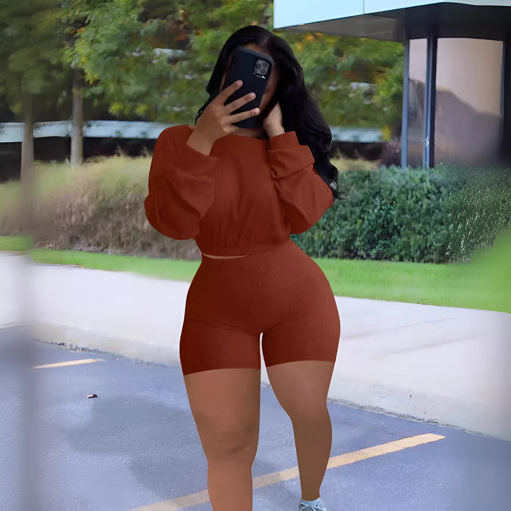 Women's solid colour off-the-shoulder long sleeve top and matching shorts two-piece set.