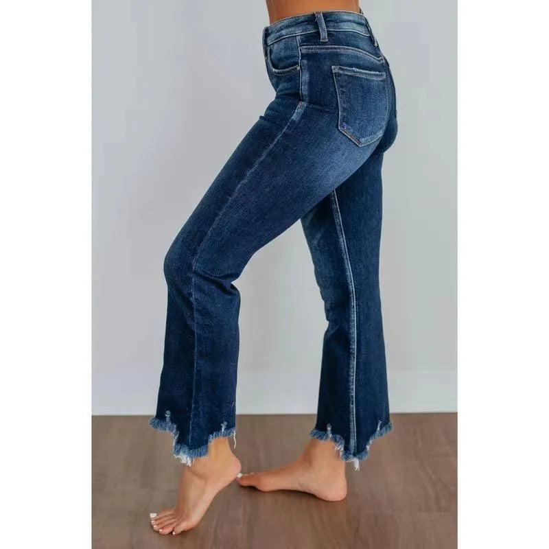 Women's solid colour denim jeans with hand-worn distressing in light blue wash, straight leg fit