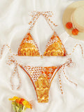 Women's green bandage style bikini with printed stitching on a briefs bottom.