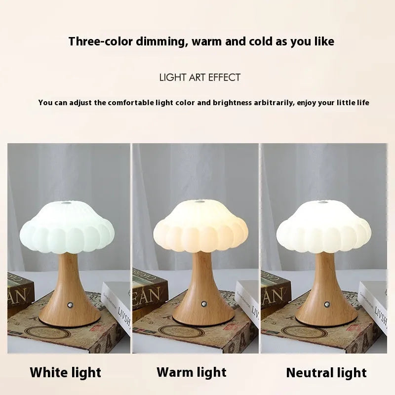 Mushroom-shaped charging touch night light in five colour options on wooden table