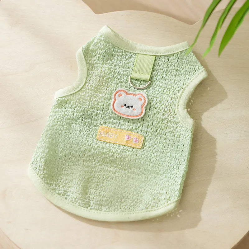 Cat wearing blue bear patch clothing with hollowed-out knitted fabric construction
