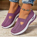 Pair of low top casual mesh shoes with T-strap and soft PVC sole in solid colour for elderly women