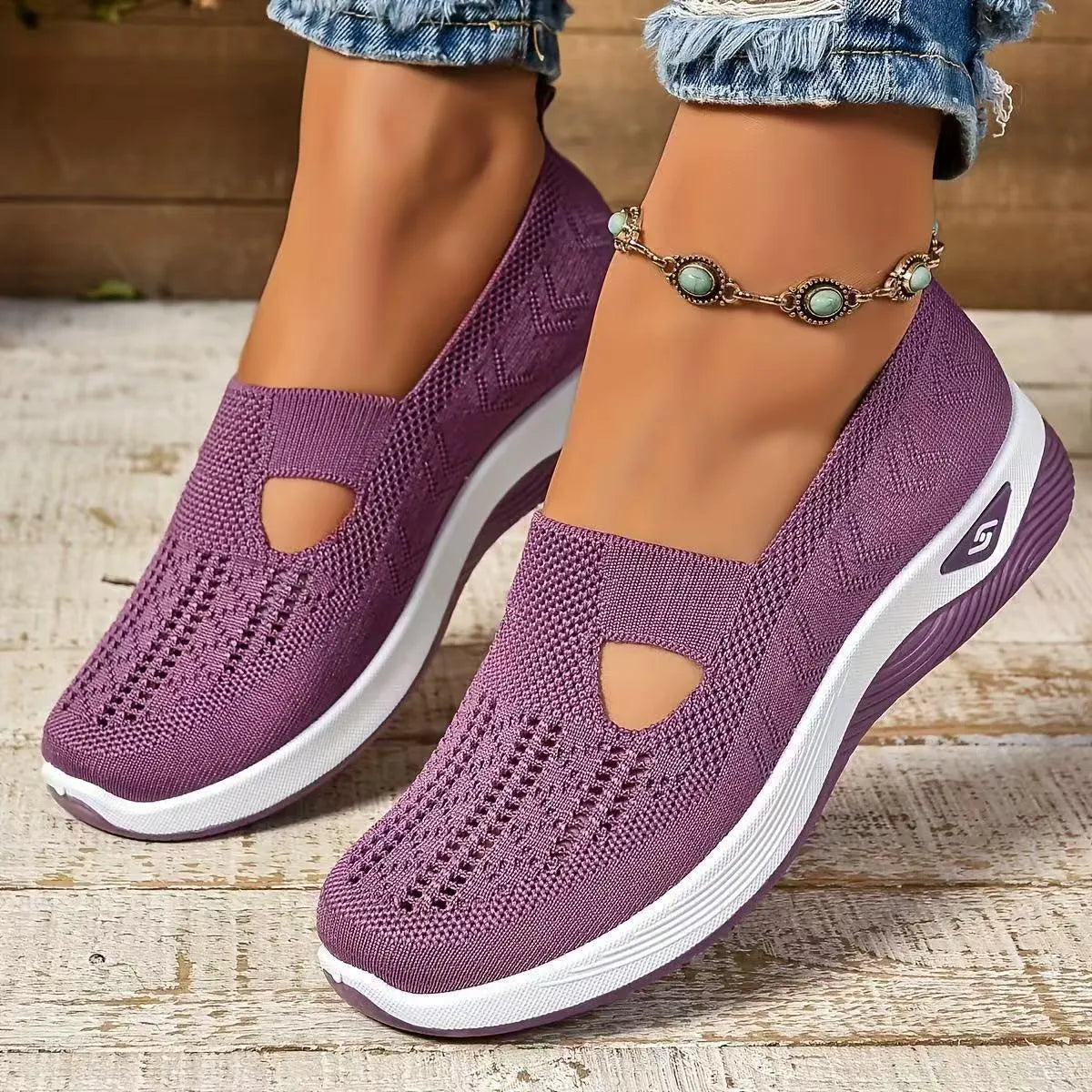 Pair of low top casual mesh shoes with T-strap and soft PVC sole in solid colour for elderly women