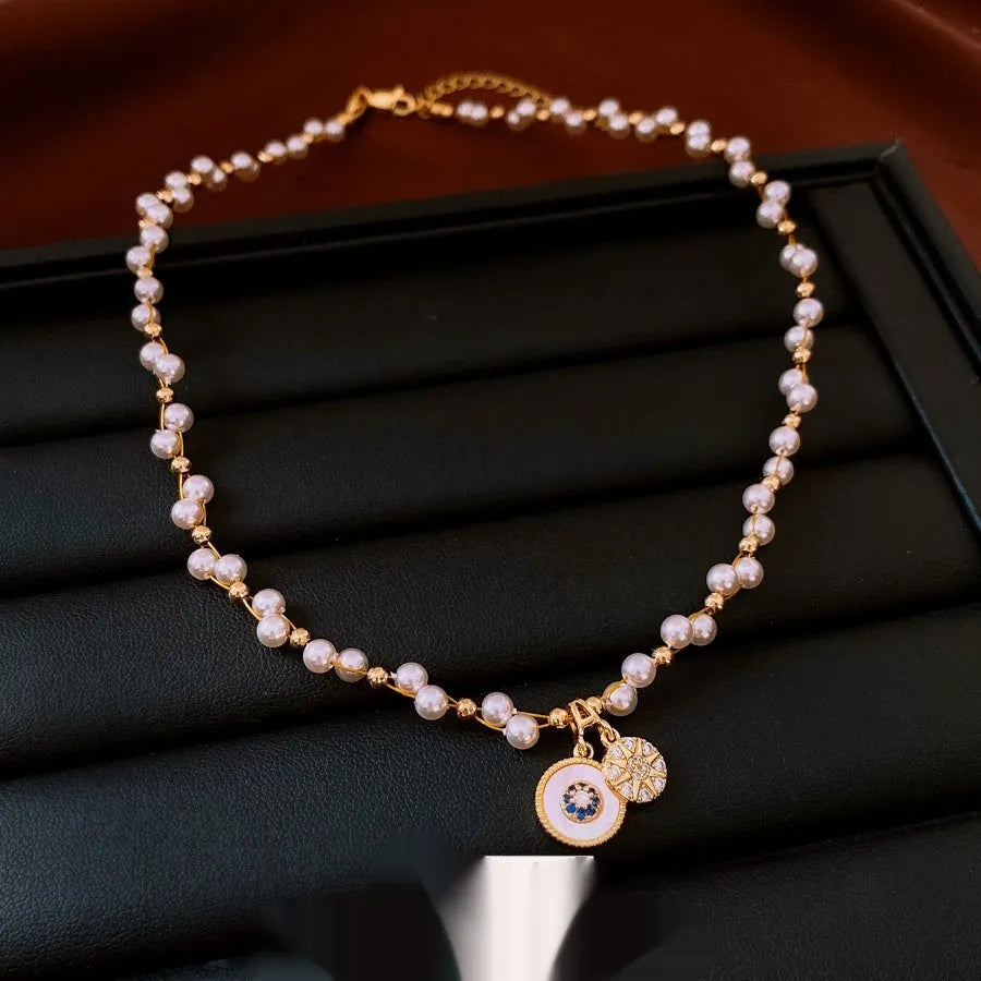 Gold plated clavicle chain necklace with round zircon and imitation pearl pendant