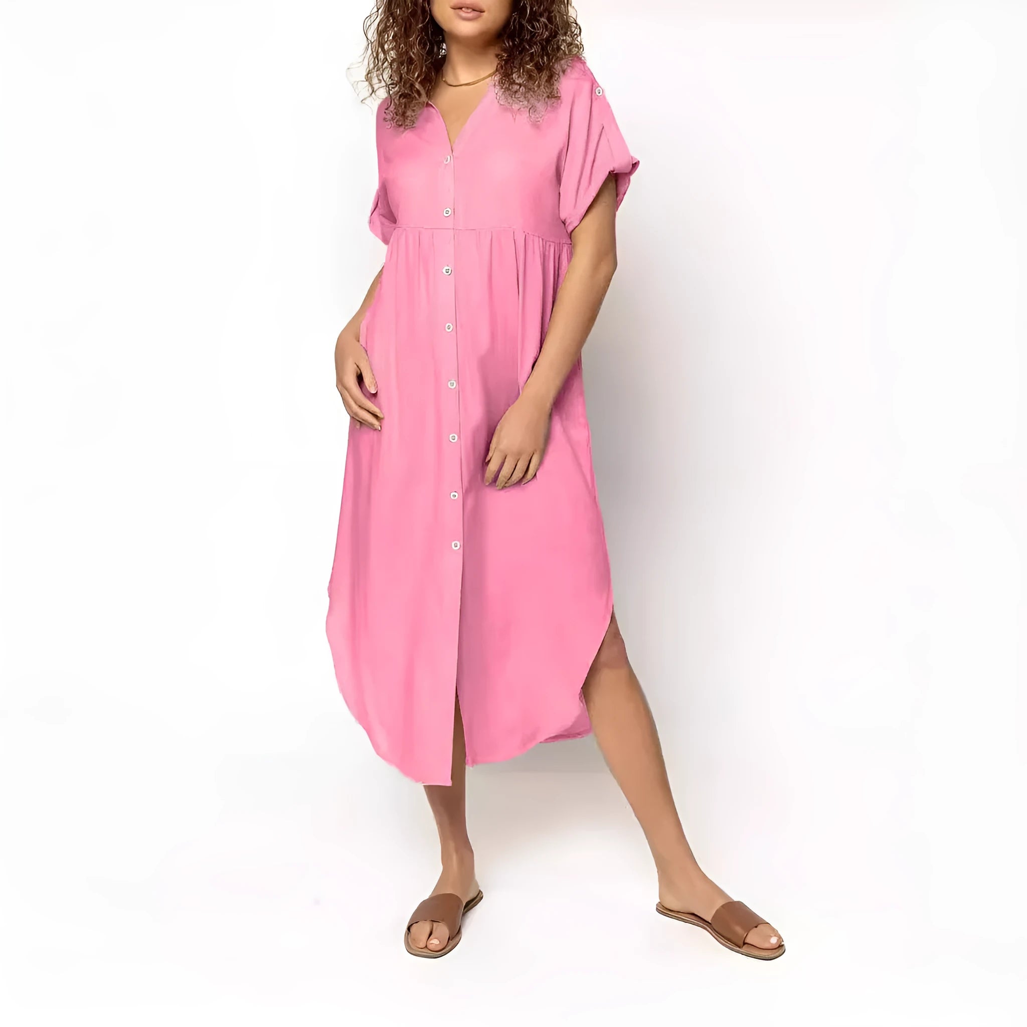 A loose-fitting, solid-colour mid-length casual dress with a front button closure and regular sleeves.