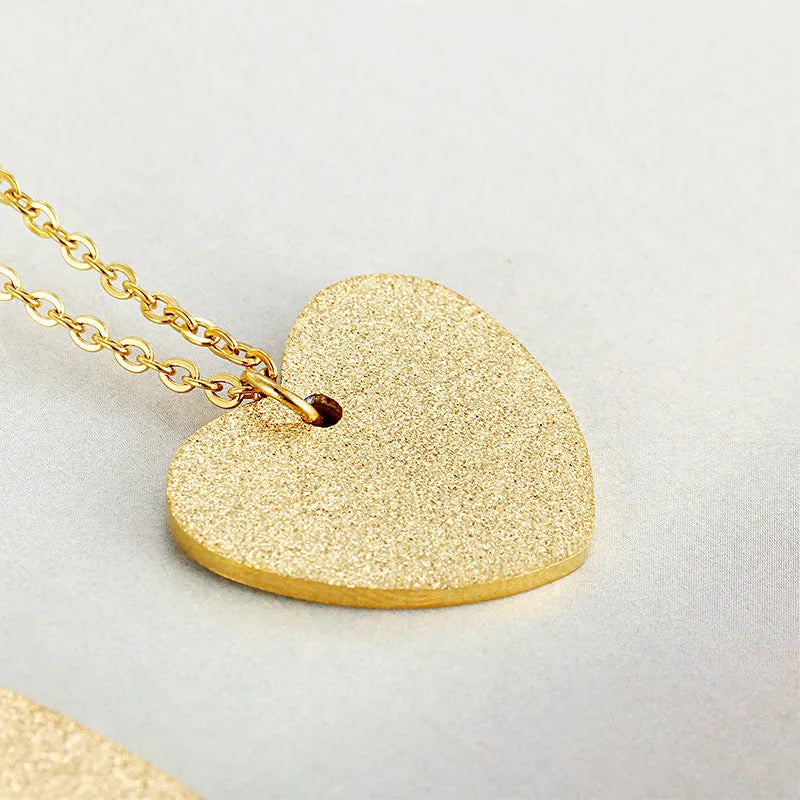 Women's titanium steel heart pendant necklace with geometric design elements