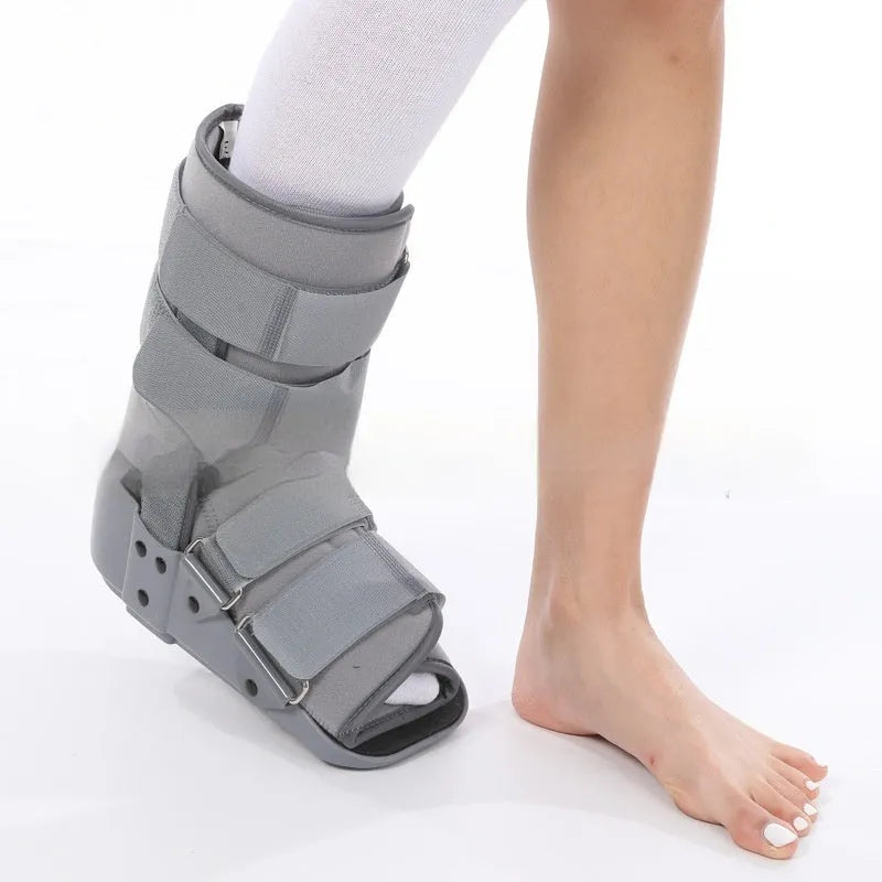 Achilles tendon rehabilitation walking boots in grey and black colours with adjustable straps