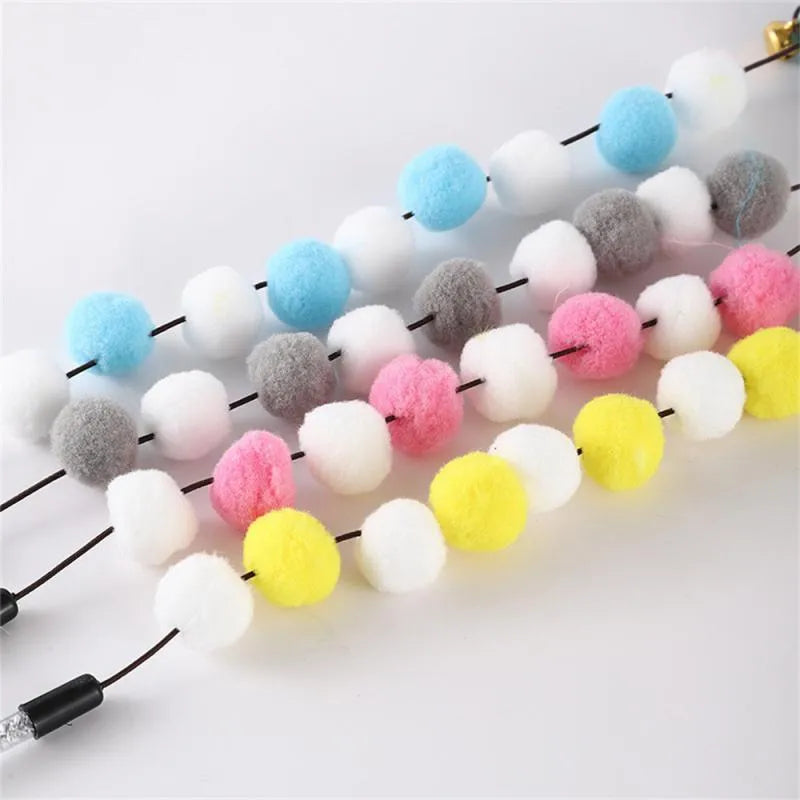 Colourful cat teaser stick with bell, feather, and acrylic pom-pom attachments on 31cm stick