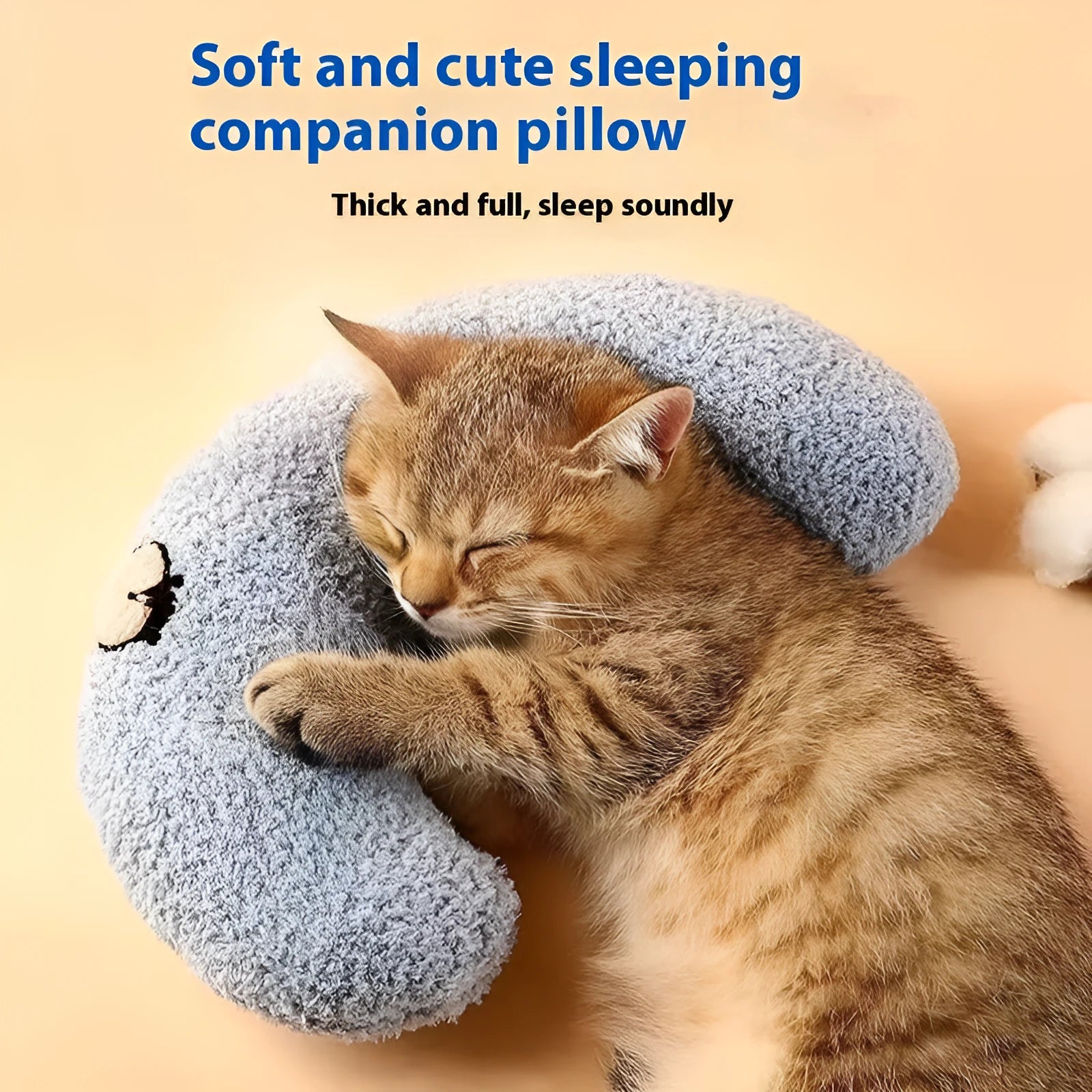 Blue U-shaped cat neck protection pillow on pet bed