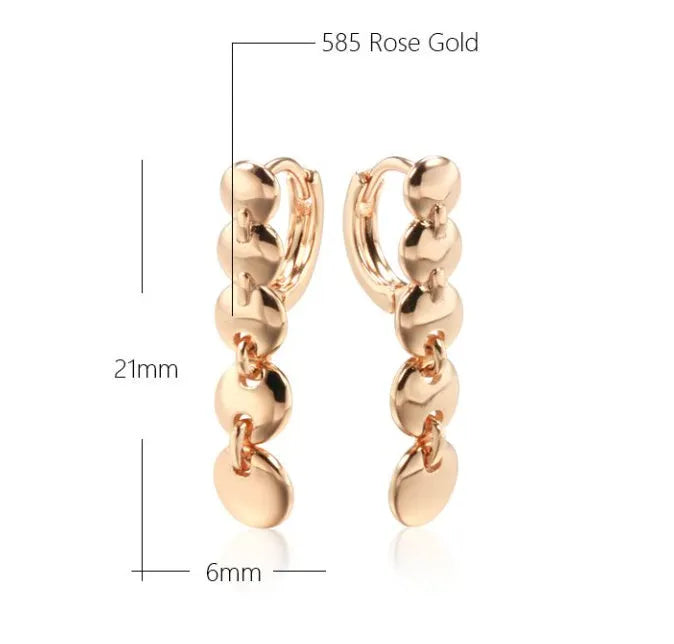 Long gold retro circle earrings with woven chain design, shown from the side.
