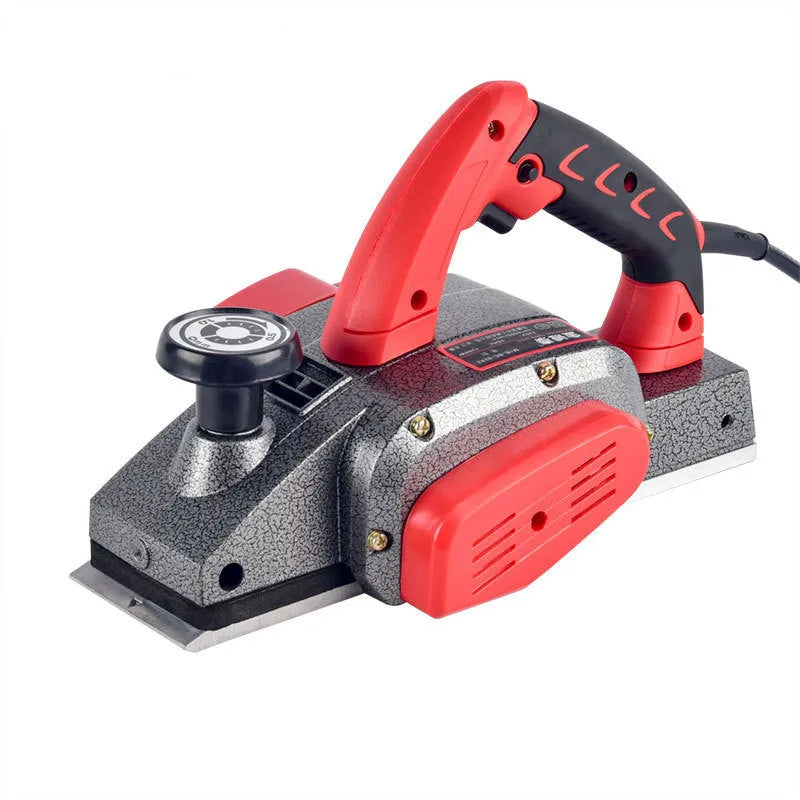 Red aluminium electric wood planer tool with 82mm cutting width on workbench