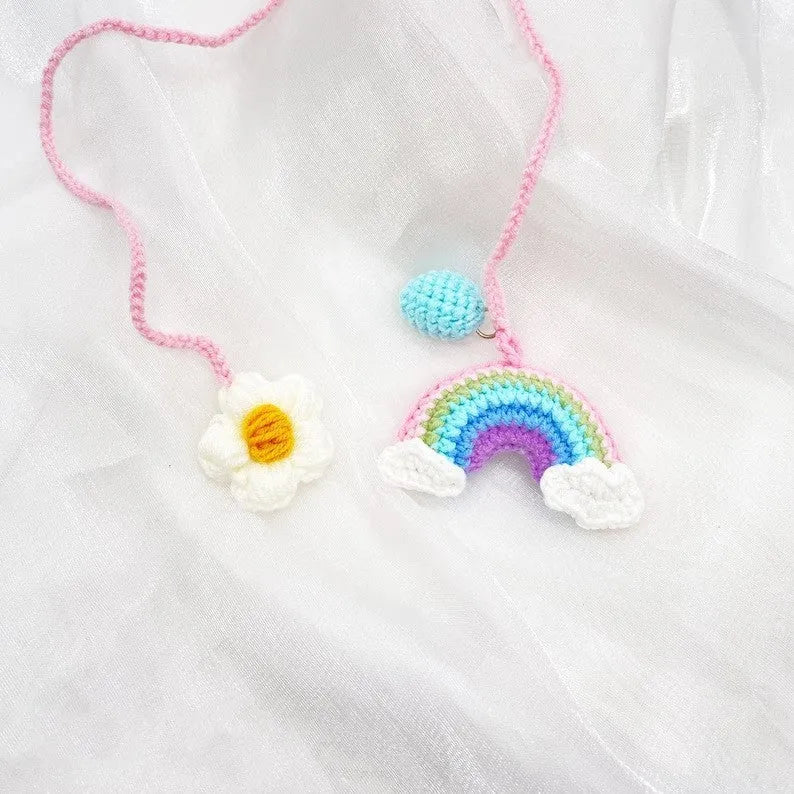 Handmade crocheted wool car pendant in avocado colour with rainbow flower design