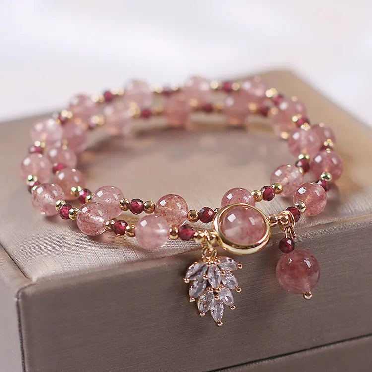 Women's double layer crystal bracelet with lucky cat charm and red cat's eye flower beads.