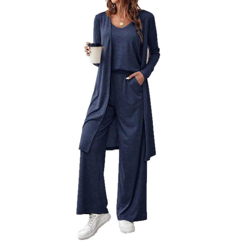 Blue women's three-piece casual suit with cardigan, top, and trousers on a hanger.