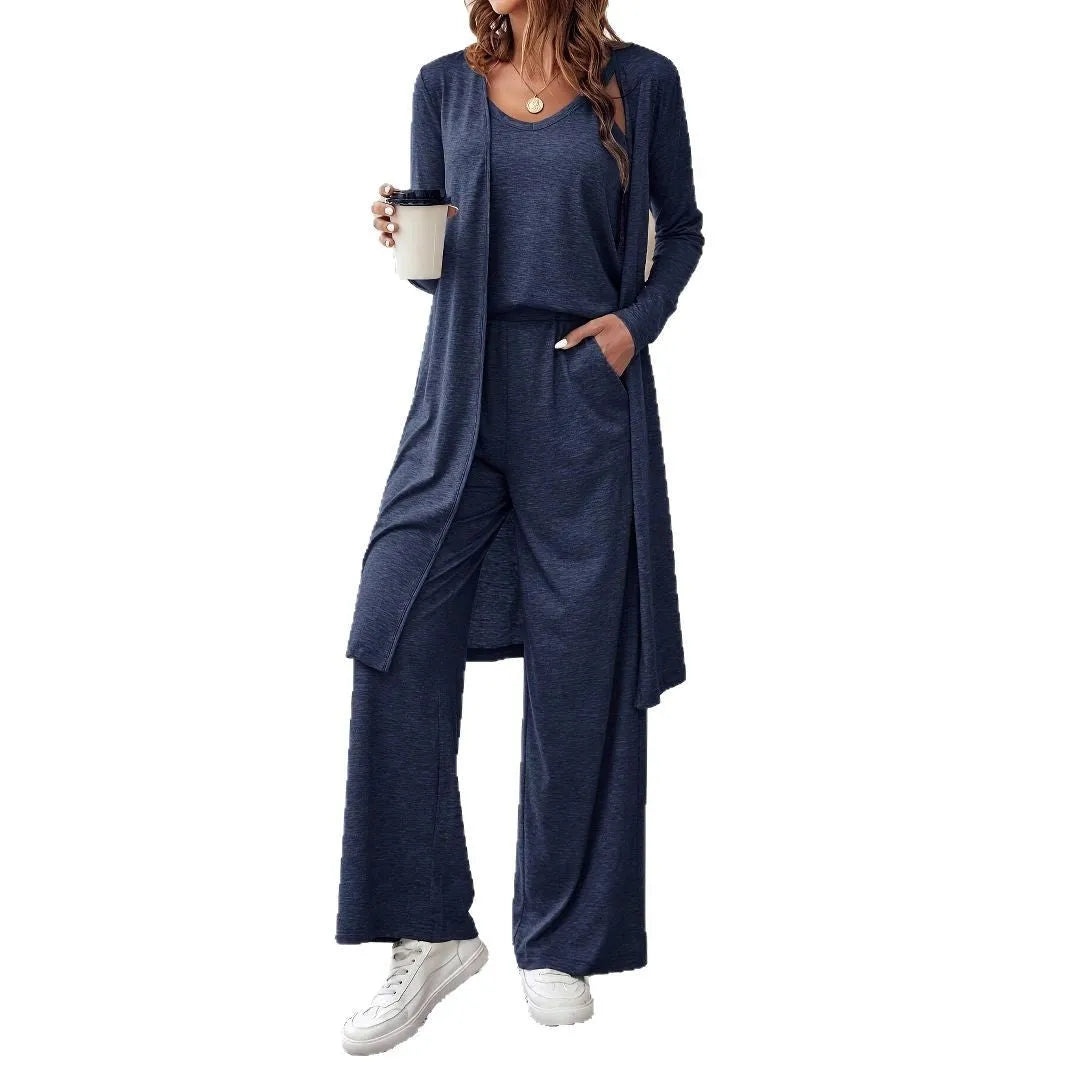 Blue women's three-piece casual suit with cardigan, top, and trousers on a hanger.