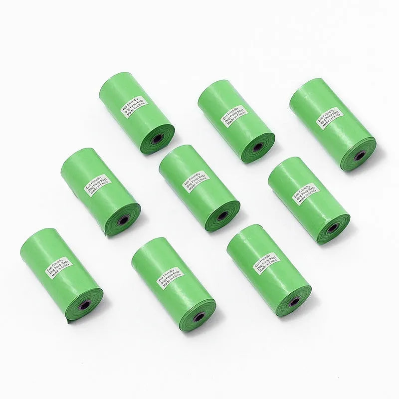 EPI degradable pet waste bag rolls in green, black, blue, and orange colours with a capsule dispenser.