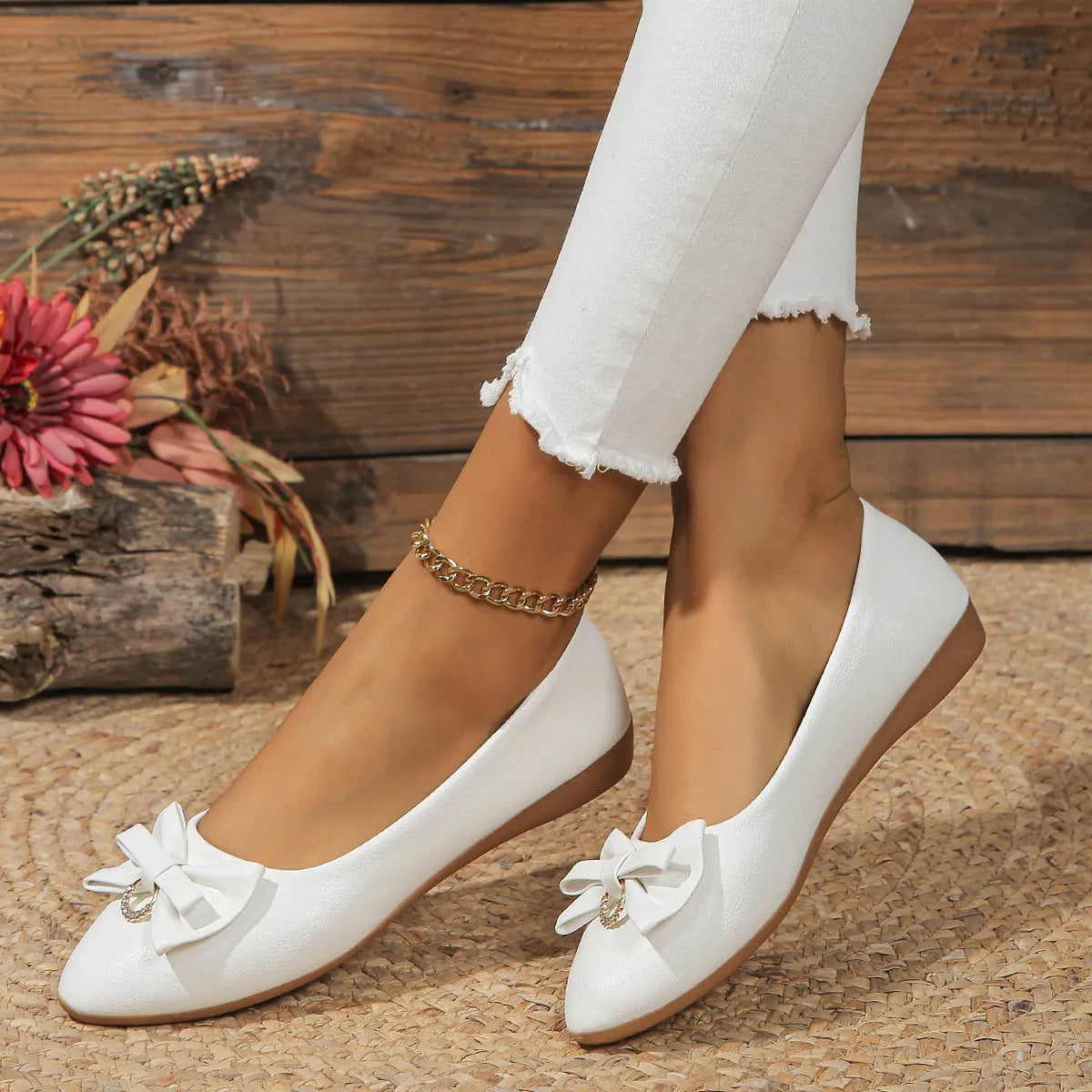 Women's beige casual flat slip-on shoes with a bowknot and shallow mouth design on a rubber sole.
