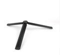 Black aluminium mobile phone tripod stabilizer with PTZ functionality on a table