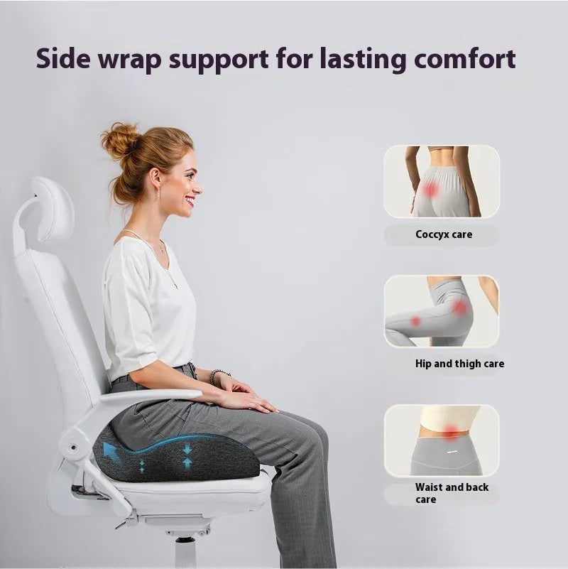 Memory foam office chair cushion in light grey on a desk chair.