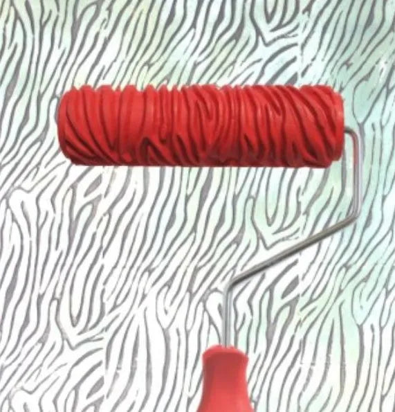Red 7-inch textured paint embossing roller with patterned rubber head for creating wallpaper effects