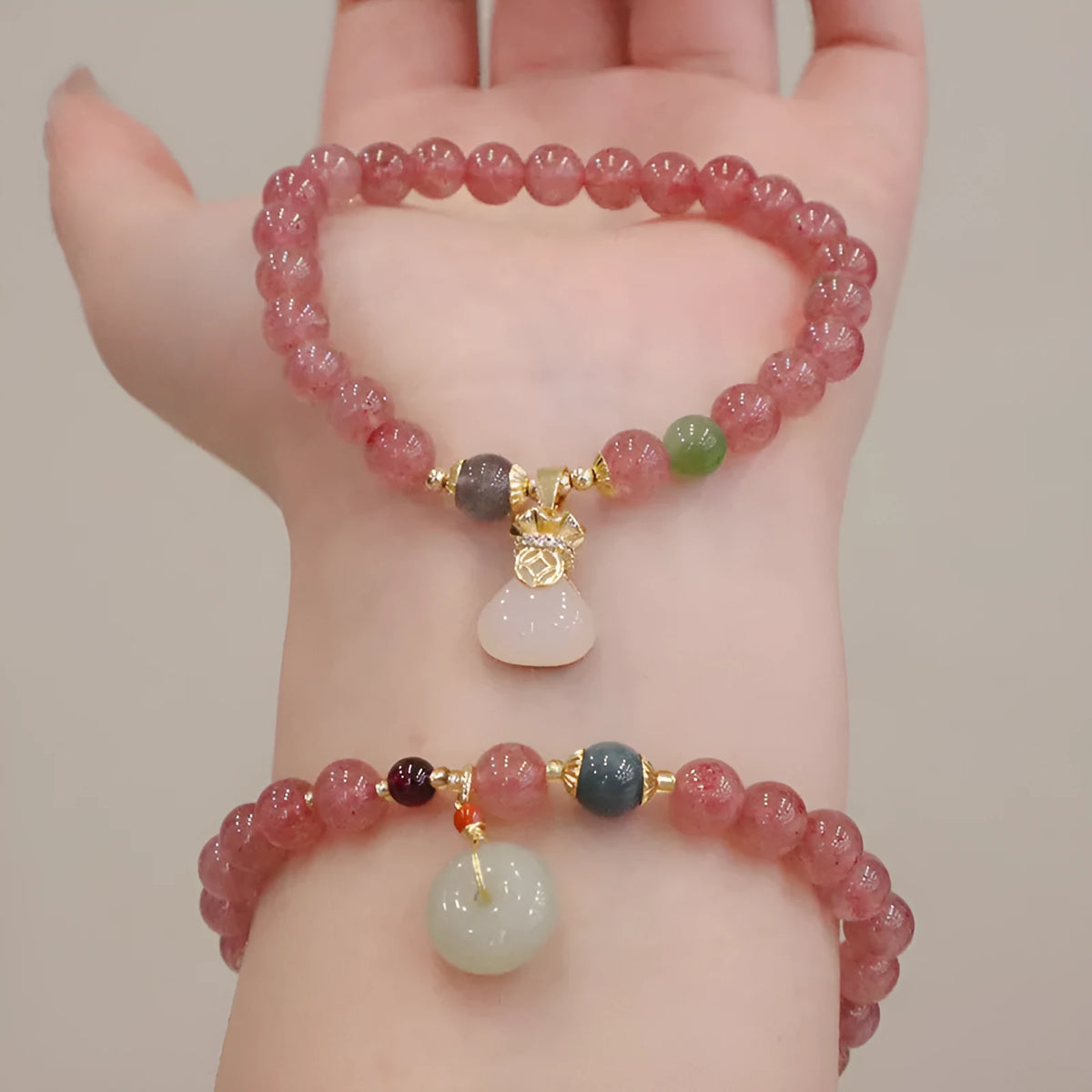 Strawberry quartz bracelet with Chinese purse charm and Hetian jade accents